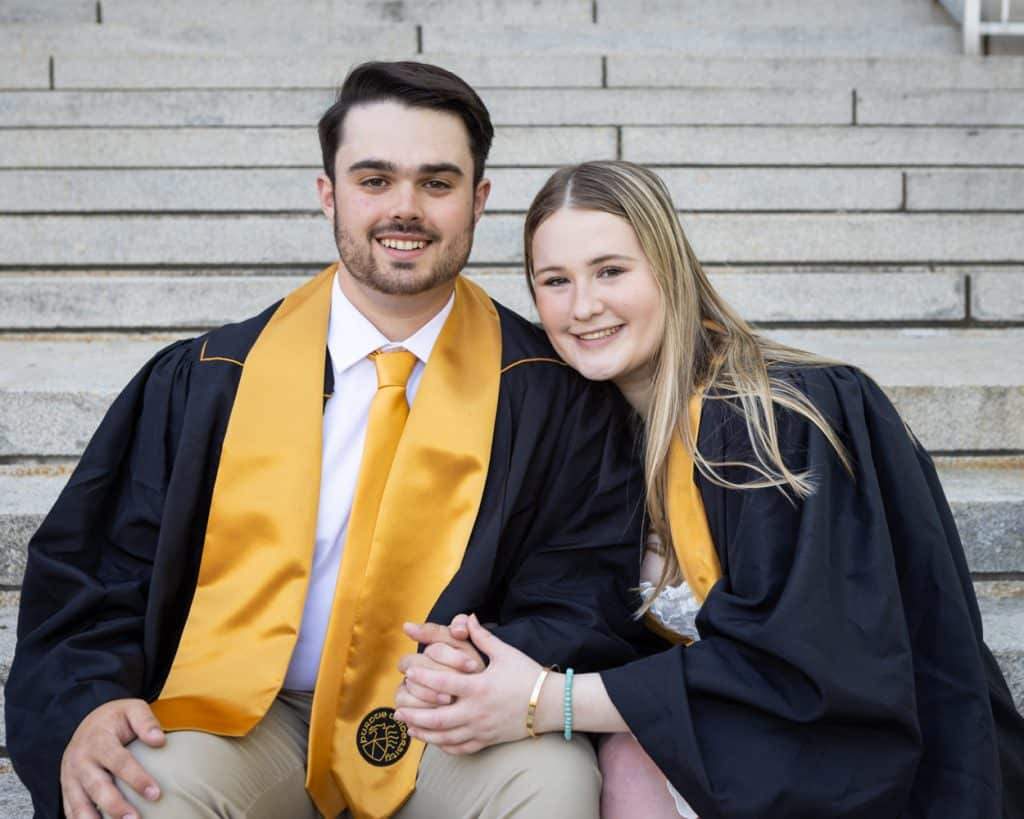 two Purdue grads pose for their graduation photo session