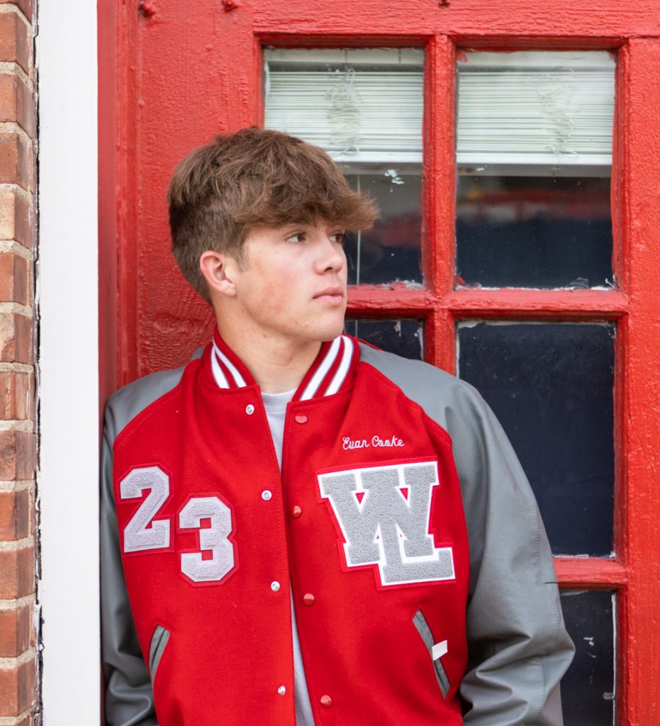 Senior boy poses for his senior photos and senior pictures in Downtown Lafayette