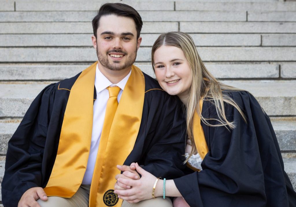 two Purdue grads pose for their graduation photo session
